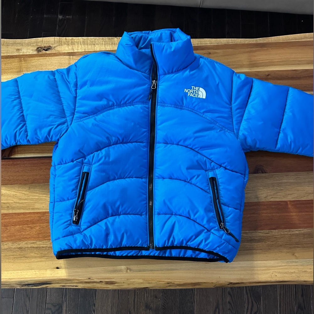 The North Face retro style stunning blue puffer worn once SOLD to Plato’s